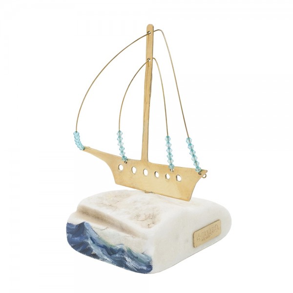A brass ship on raw marble with painted waves 17x8x10cm